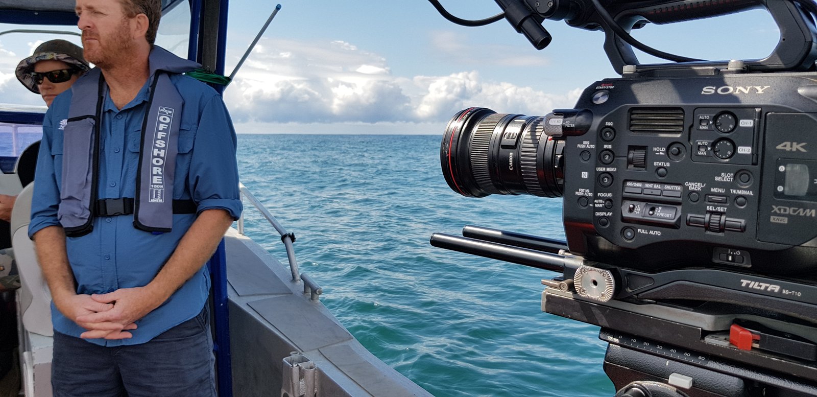 Cinema camera rigged on a boat with open ocean behind