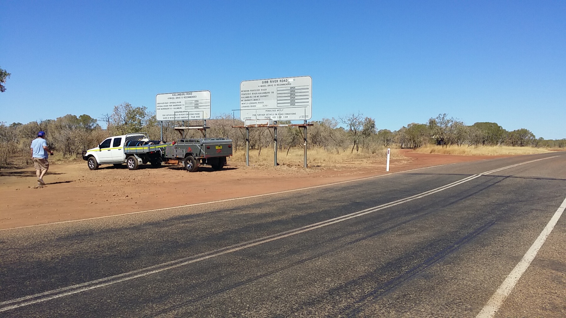 Sony FX9 on a tripod beside a red dirt outback road