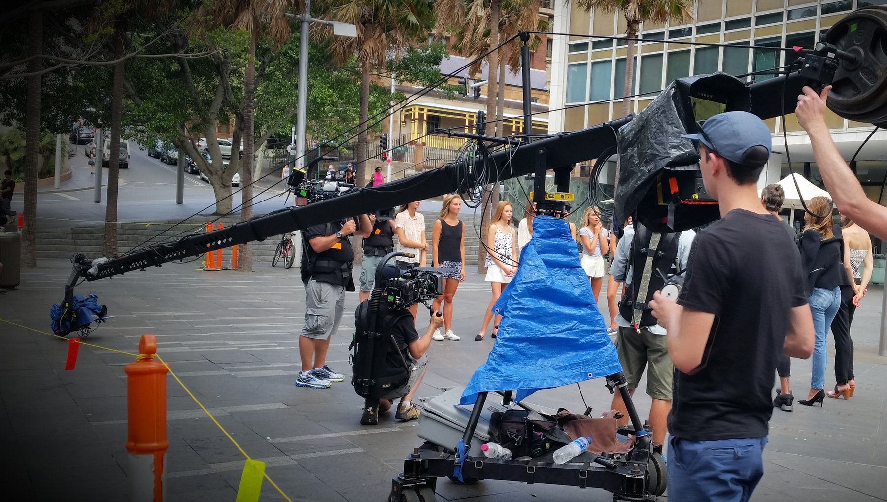 Crew operating a jib on a street shoot
