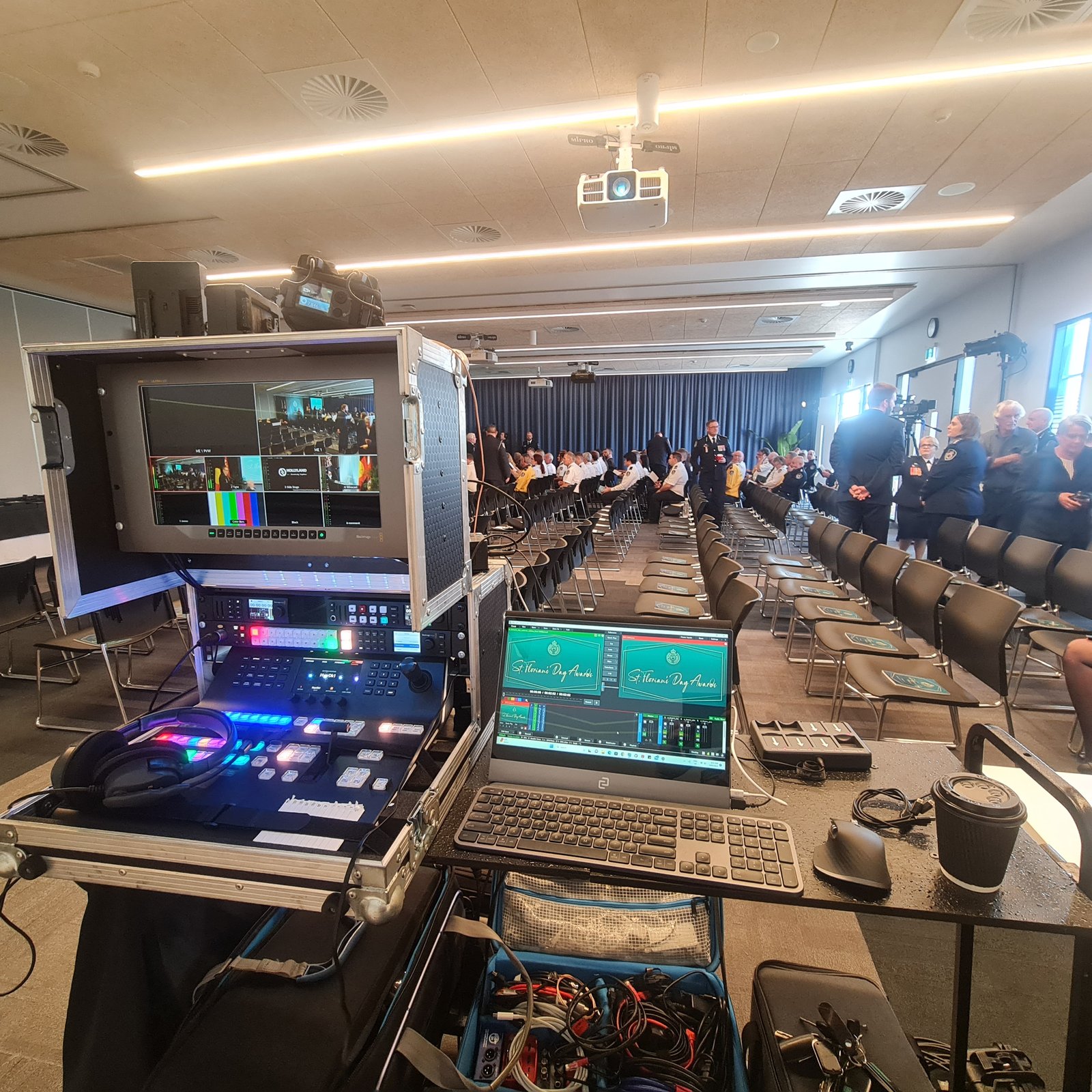 A live vision desk and multiview set up at the back of a full function room